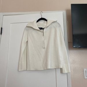 White collared sweater.